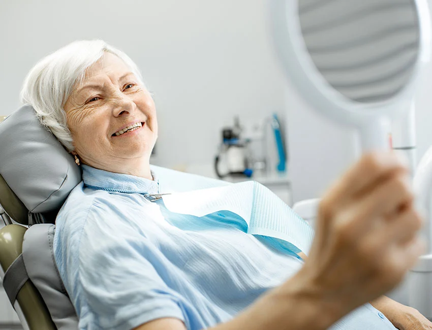 Senior lady after all-on-4 dental procedure