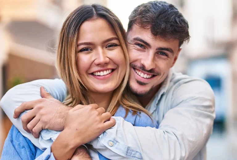 Young couple with white beautiful teeth