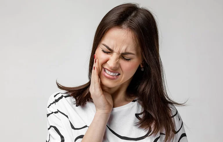 Female with sharp tooth pain